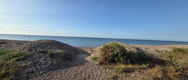 The cut through the shingle bank down to the beach